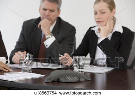 Picture - Businesspeople having teleconference. Fotosearch