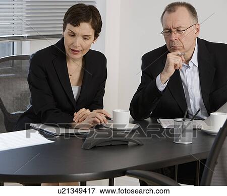 Businesspeople having teleconference View Large Photo Image Stock Photo - Businesspeople having teleconference. Fotosearch