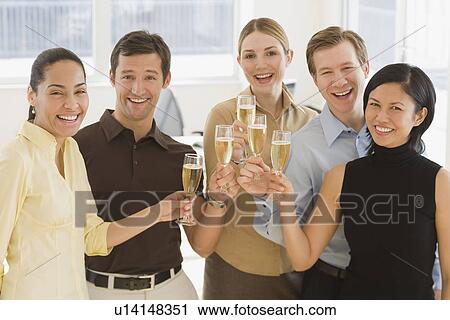 Businesspeople toasting with champagne View Large Photo Image Stock Image - Businesspeople toasting with champagne. Fotosearch