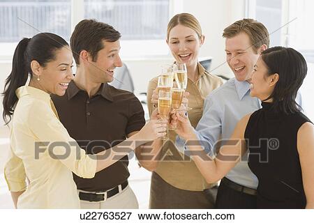 Businesspeople toasting with champagne View Large Photo Image Stock Photo - Businesspeople toasting with champagne. Fotosearch