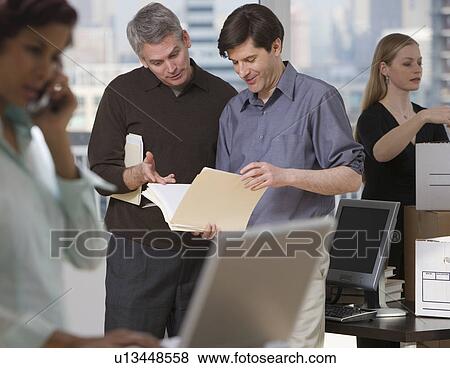 Businesspeople working in new office View Large Photo Image Stock Photo - Businesspeople working in new office. Fotosearch