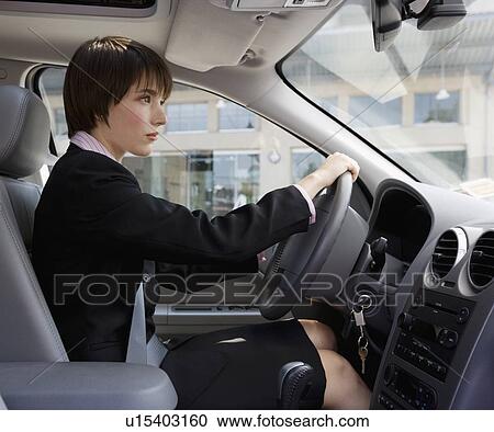 Businesswoman driving car View Large Photo Image Stock Image - Businesswoman driving car. Fotosearch