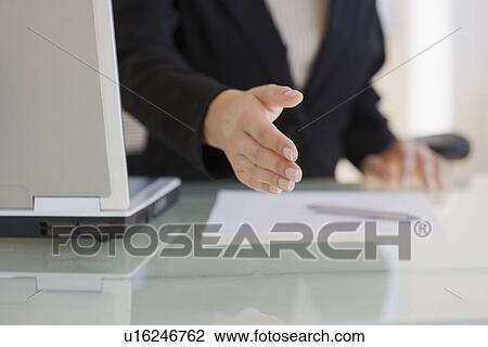 Businesswoman extending hand to shake View Large Photo Image Stock Image - Businesswoman extending hand to shake. Fotosearch