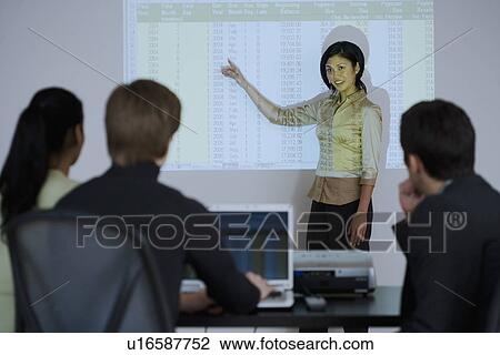 Businesswoman giving presentation View Large Photo Image Stock Image - Businesswoman giving presentation. Fotosearch