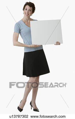 Businesswoman holding blank sign View Large Photo Image Stock Image - Businesswoman holding blank sign. Fotosearch