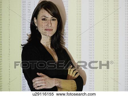 Stock Photography - Businesswoman in front of spreadsheet projection. Fotosearch