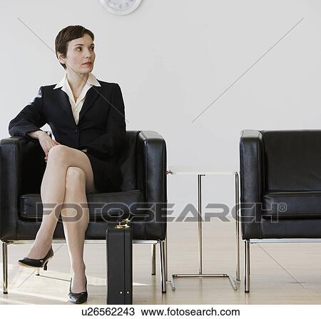 Businesswoman sitting in waiting area View Large Photo Image Stock Image - Businesswoman sitting in waiting area. Fotosearch