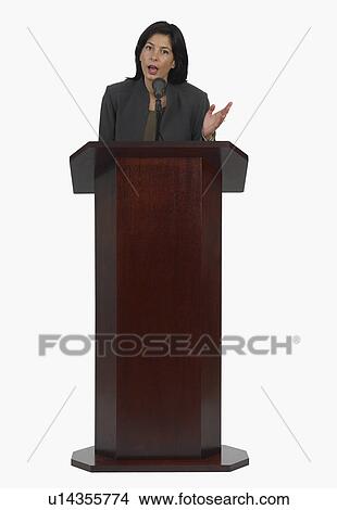 Businesswoman speaking at podium View Large Photo Image Picture - Businesswoman speaking at podium. Fotosearch