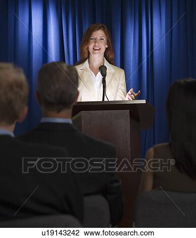 Businesswoman speaking at podium View Large Photo Image Stock Image - Businesswoman speaking at podium. Fotosearch
