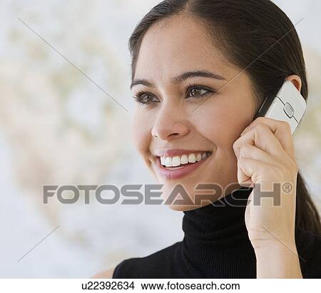 Businesswoman talking on cell phone View Large Photo Image Picture - Businesswoman talking on cell phone. Fotosearch