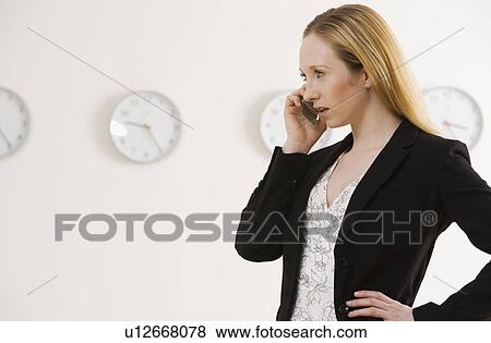Businesswoman talking on cell phone View Large Photo Image Stock Photo - Businesswoman talking on cell phone. Fotosearch