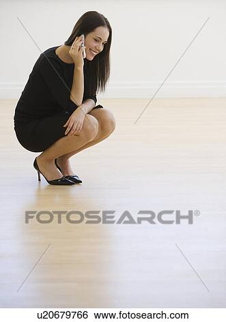 Businesswoman talking on cell phone View Large Photo Image Stock Photograph - Businesswoman talking on cell phone. Fotosearch