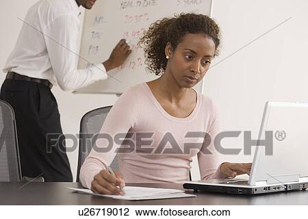 Businesswoman typing on laptop View Large Photo Image Stock Image - Businesswoman typing on laptop. Fotosearch
