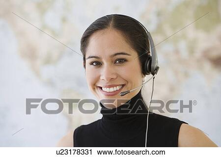 Businesswoman wearing headset View Large Photo Image Stock Image - Businesswoman wearing headset. Fotosearch