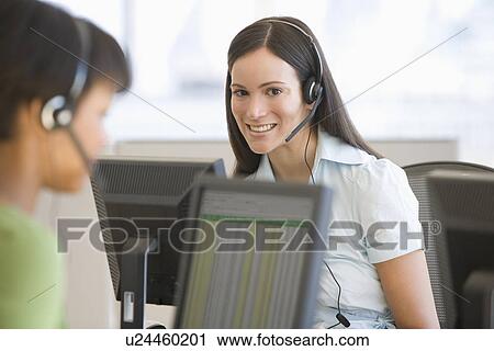 Businesswoman wearing headset View Large Photo Image Stock Image - Businesswoman wearing headset. Fotosearch