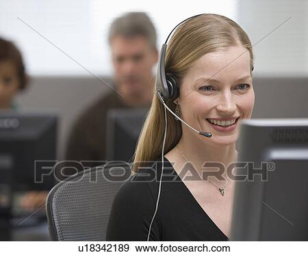 Businesswoman wearing headset View Large Photo Image Stock Photo - Businesswoman wearing headset. Fotosearch