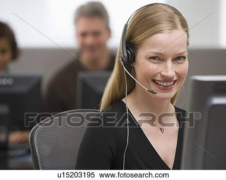 Stock Photography - Businesswoman wearing headset. Fotosearch