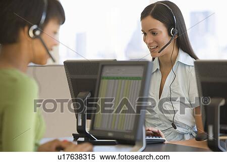 Businesswoman wearing headset View Large Photo Image Stock Photography - Businesswoman wearing headset. Fotosearch