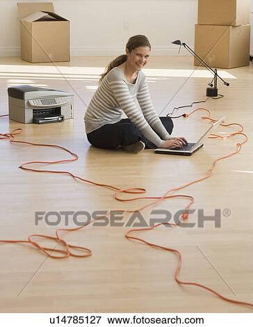 Businesswoman working in new office View Large Photo Image Stock Photo - Businesswoman working in new office. Fotosearch