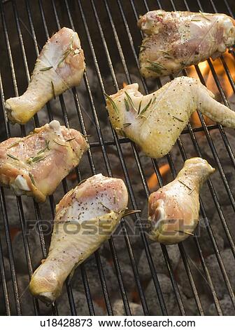 Chicken pieces cooking on grill View Large Photo Image Stock Image - Chicken pieces cooking on grill. Fotosearch