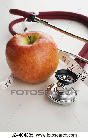 Close up of apple, tape measure and stethoscope View Large Photo Image Stock Photography - Close up of apple, tape measure and stethoscope. Fotosearch