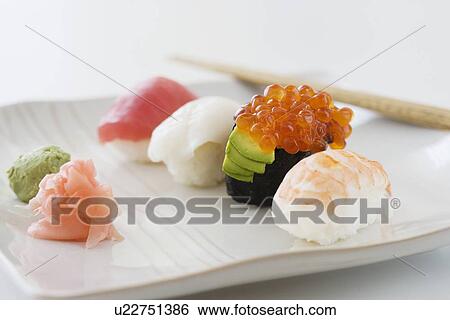 Close up of assorted sushi on plate View Large Photo Image Stock Photograph - Close up of assorted sushi on plate . Fotosearch