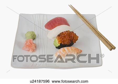 Close up of assorted sushi on plate View Large Photo Image Stock Photograph - Close up of assorted sushi on plate . Fotosearch