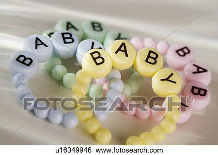 Close up of baby bracelets View Large Photo Image Stock Photograph - Close up of baby bracelets. Fotosearch