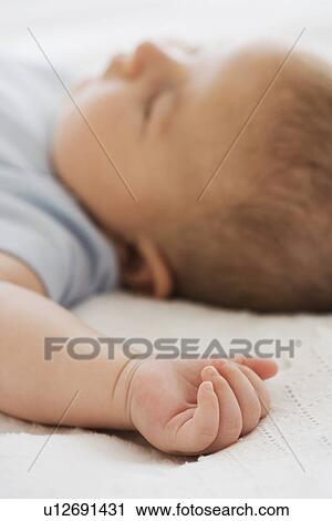 Stock Image - Close up of baby sleeping. Fotosearch
