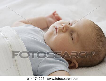 Stock Photograph - Close up of baby sleeping. Fotosearch