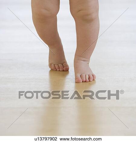 Close up of baby’s feet walking View Large Photo Image Stock Image - Close up of baby’s feet walking. Fotosearch