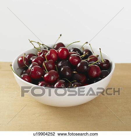 Stock Image - Close up of bowl of cherries. Fotosearch