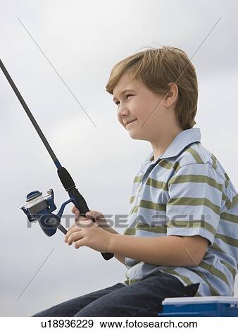 Stock Photo - Close up of boy fishing. Fotosearch