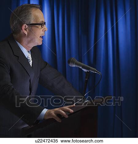 Close up of businessman speaking at podium View Large Photo Image Stock Photography - Close up of businessman speaking at podium. Fotosearch