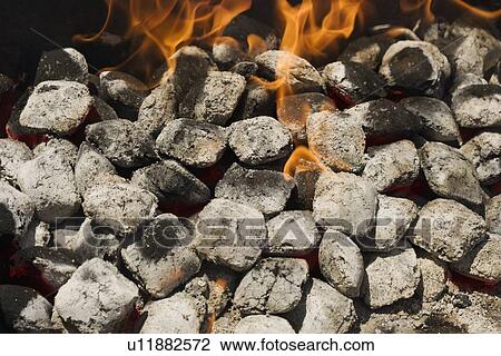 Close up of charcoal briquette fire View Large Photo Image Stock Image - Close up of charcoal briquette fire. Fotosearch