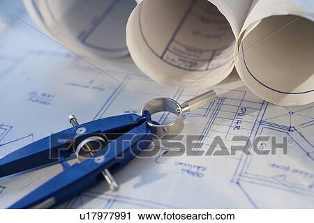 Close up of compass on blueprints View Large Photo Image Stock Image - Close up of compass on blueprints. Fotosearch