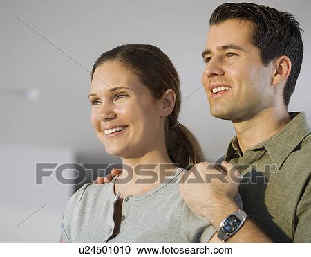 Close up of couple smiling View Large Photo Image Stock Image - Close up of couple smiling. Fotosearch