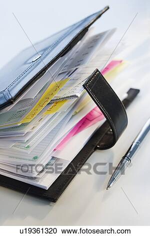 Close up of datebook and pen View Large Photo Image Stock Image - Close up of datebook and pen. Fotosearch