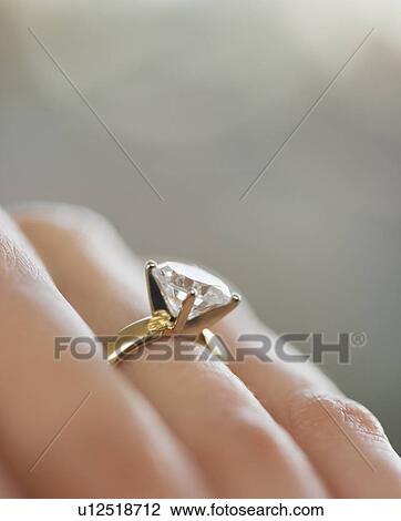 Close up of diamond engagement ring View Large Photo Image Stock Image - Close up of diamond engagement ring. Fotosearch