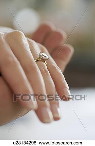 Stock Photo - Close up of diamond engagement ring. Fotosearch