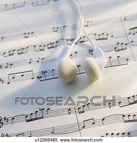 Close up of ear buds on sheet music View Large Photo Image Stock Photography - Close up of ear buds on sheet music. Fotosearch