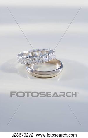 Close up of engagement and wedding rings View Large Photo Image Stock Image - Close up of engagement and wedding rings. Fotosearch