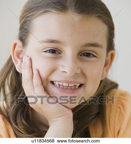 Close up of girl smiling View Large Photo Image Stock Photo - Close up of girl smiling. Fotosearch