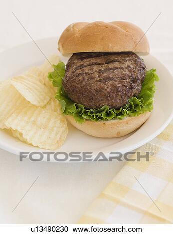 Close up of hamburger on plate View Large Photo Image Stock Image - Close up of hamburger on plate. Fotosearch
