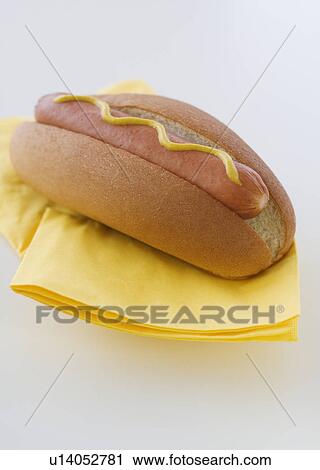 Stock Image - Close up of hot dog in bun. Fotosearch