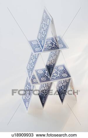 Stock Image - Close up of house of cards. Fotosearch
