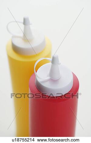 Close up of ketchup and mustard bottles View Large Photo Image Picture - Close up of ketchup and mustard bottles. Fotosearch