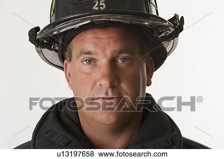 Close up of male firefighter View Large Photo Image Stock Photo - Close up of male firefighter. Fotosearch