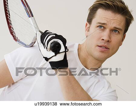 Stock Photo - Close up of man playing racquetball. Fotosearch