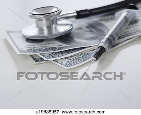 Close up of medical items and money View Large Photo Image Stock Photo - Close up of medical items and money. Fotosearch